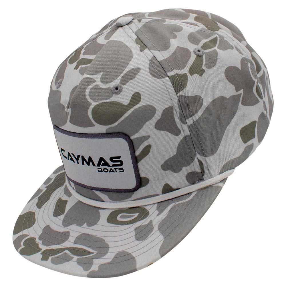 Side of a light grey camouflage-patterned cap with a white Caymas Boats rectangular patch and a rope across the bill.