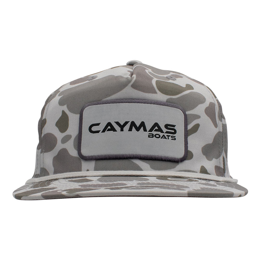 Front of a light grey camouflage-patterned cap with a white Caymas Boats rectangular patch and a white rope across the front.