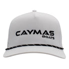 White cap with a black rope across the bill and a black caymas boats logo sewn on the front.