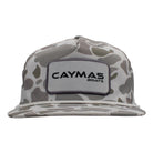 Front of a light grey camouflage-patterned cap with a white Caymas Boats rectangular patch and a white rope across the front. 