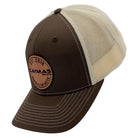 Side of a brown and beige cap with a circular Caymas Boats patch.