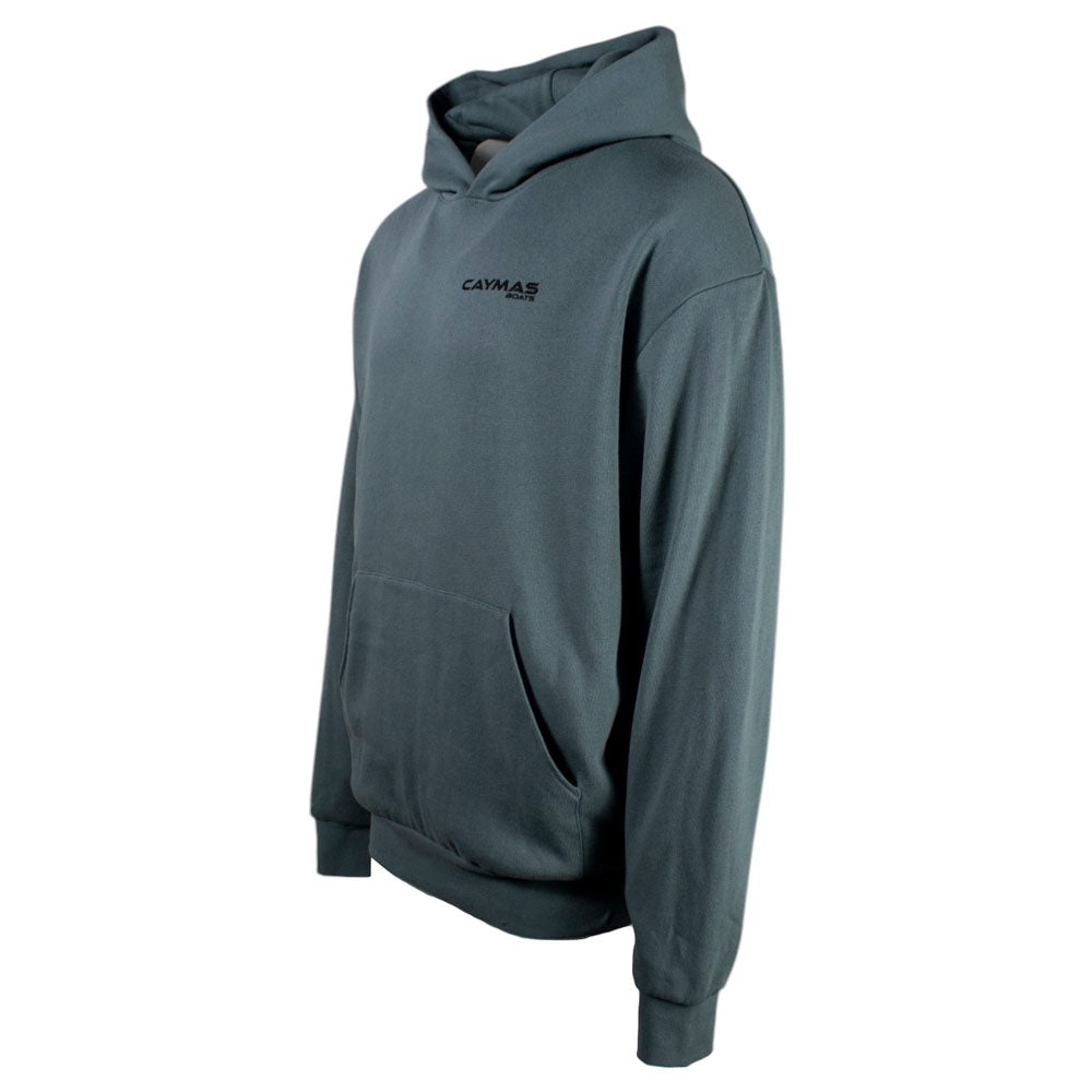 Side of a grey/blue hoodie with the Caymas logo in black on the left chest. 